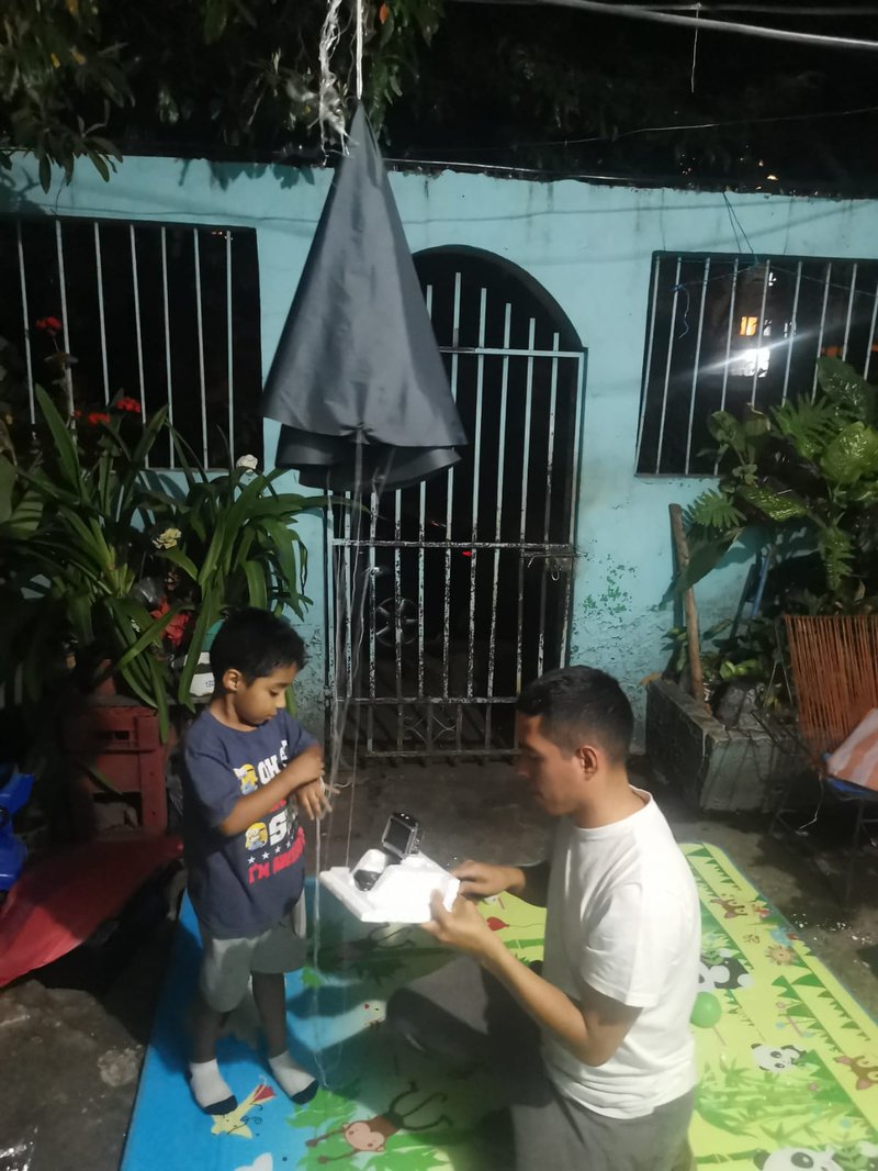 Coupling the parachute with the control box in which the camera and GPS are installed